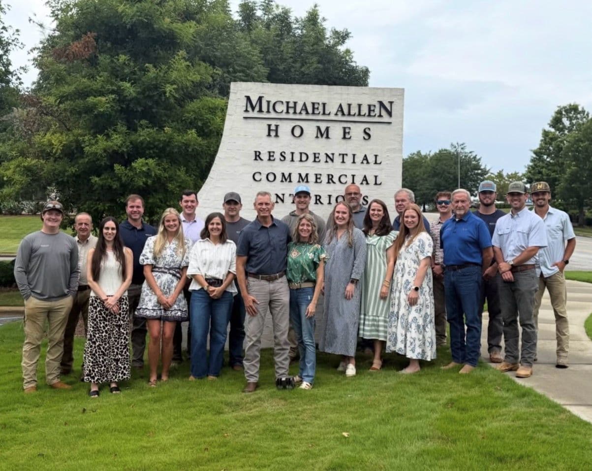 Team gathered outside Michael Allen Homes